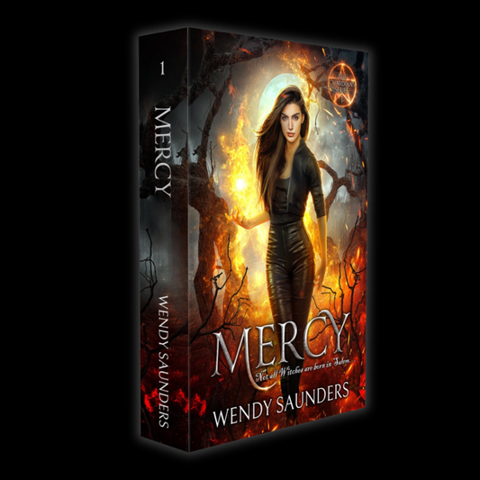 Book cover for 'Mercy' by Wendy Saunders, featuring a dark fantasy illustration of a woman in black standing before a glowing fire and moon, with the title and author name prominently displayed.